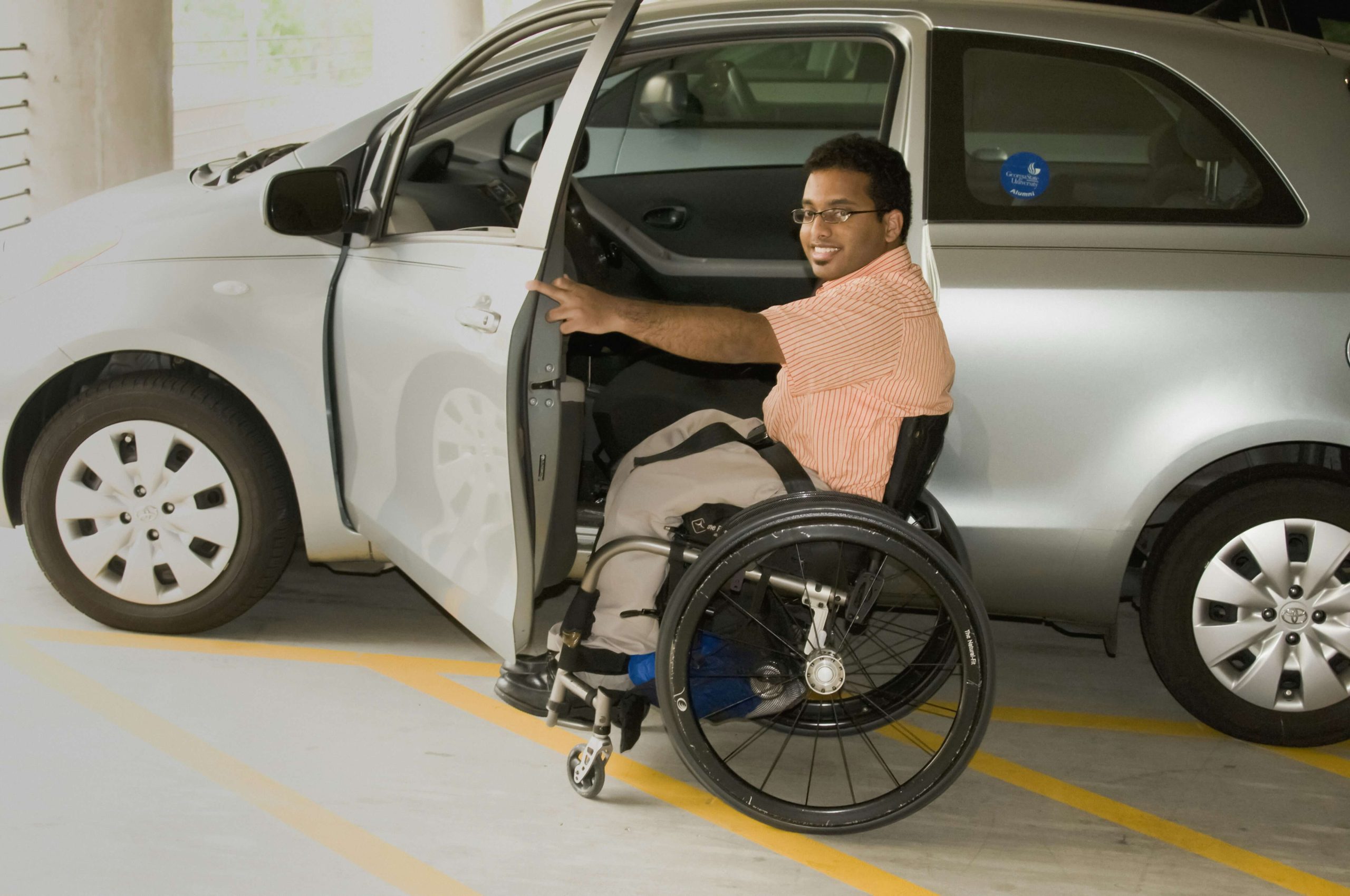 Male Wheelchair User Entering a Car