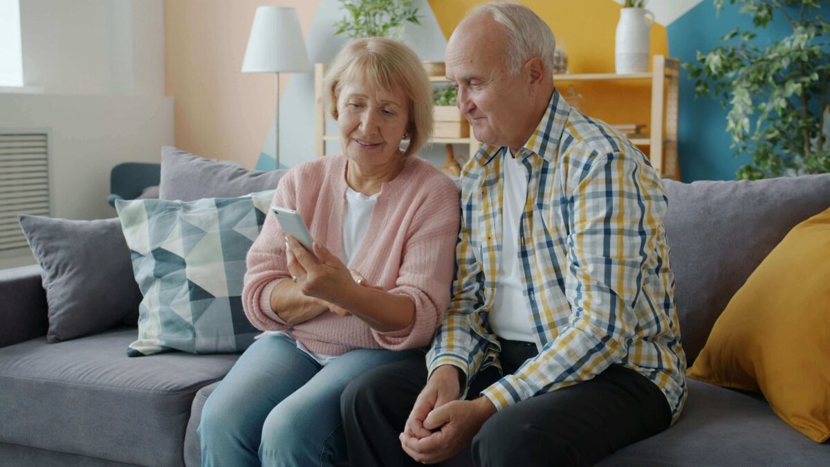 Eldery-Couple-Looking-At-Phone-2026